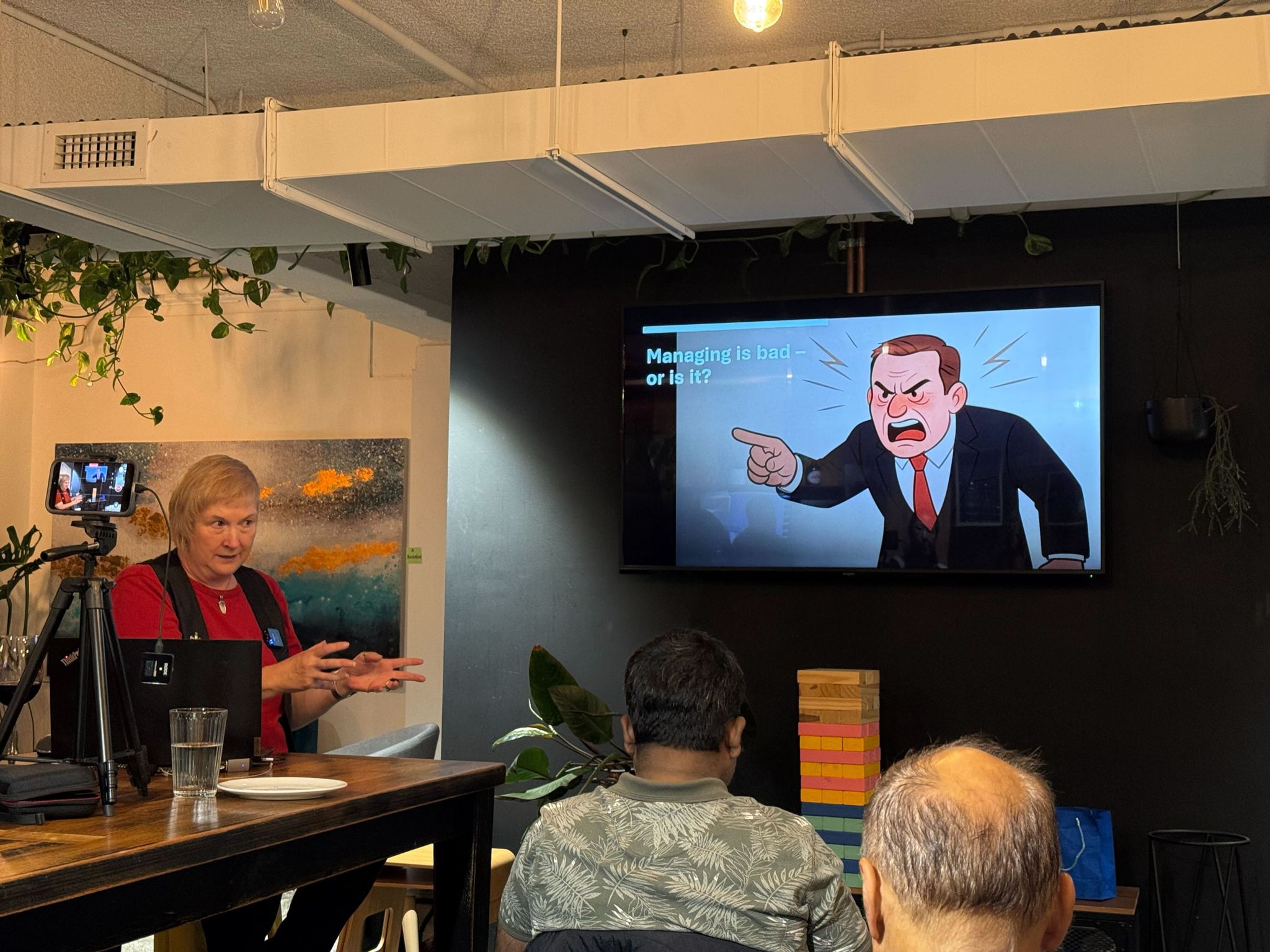Mel Kendell presenting at the Melbourne Business Agility Meetup — slide “Managing is bad – or is it?”